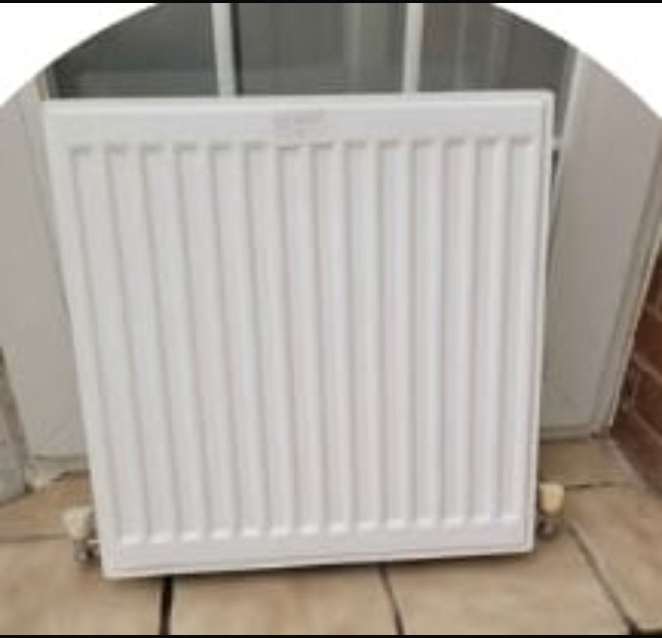 Panel radiator installation with neat pipework